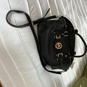 Michael Kors Black Handbag 17 “L x11 “ H x 7 “W. Strap is 46 “ Never Used !!